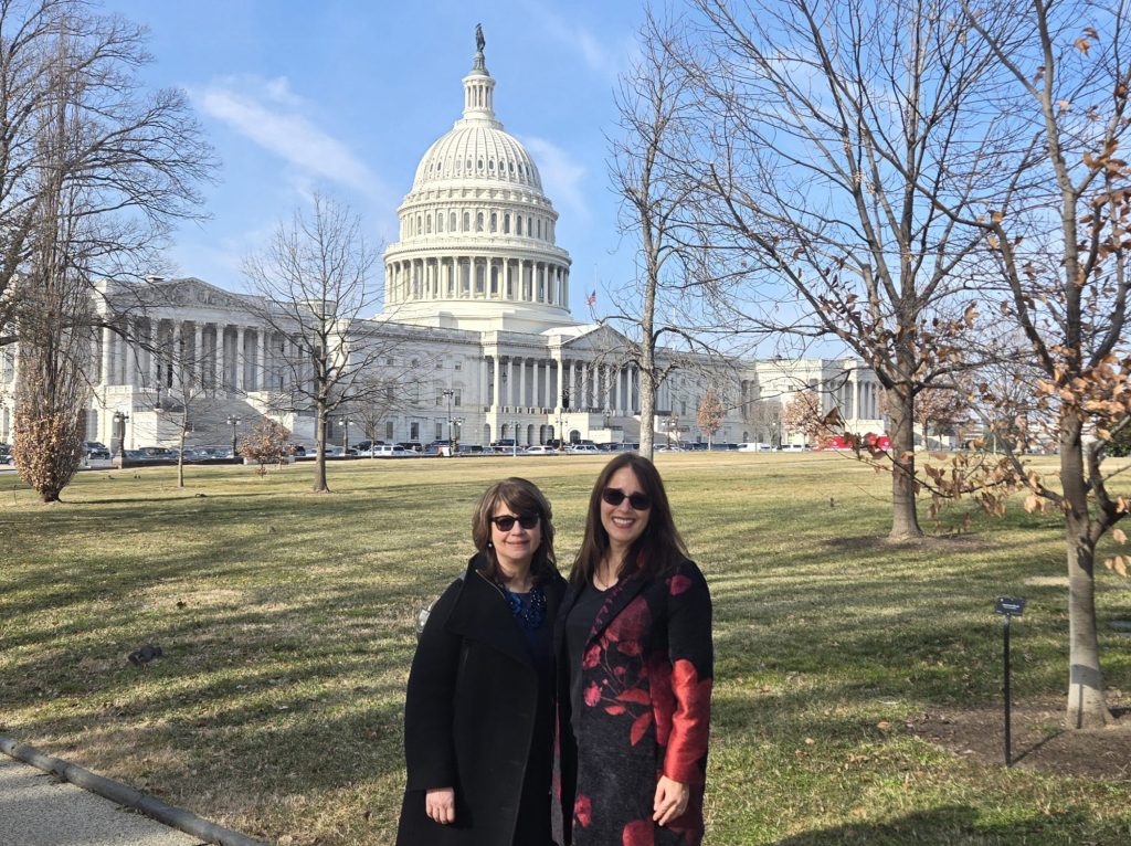Jen Talansky and Kristin Giantris stand together in front of the US Capital.