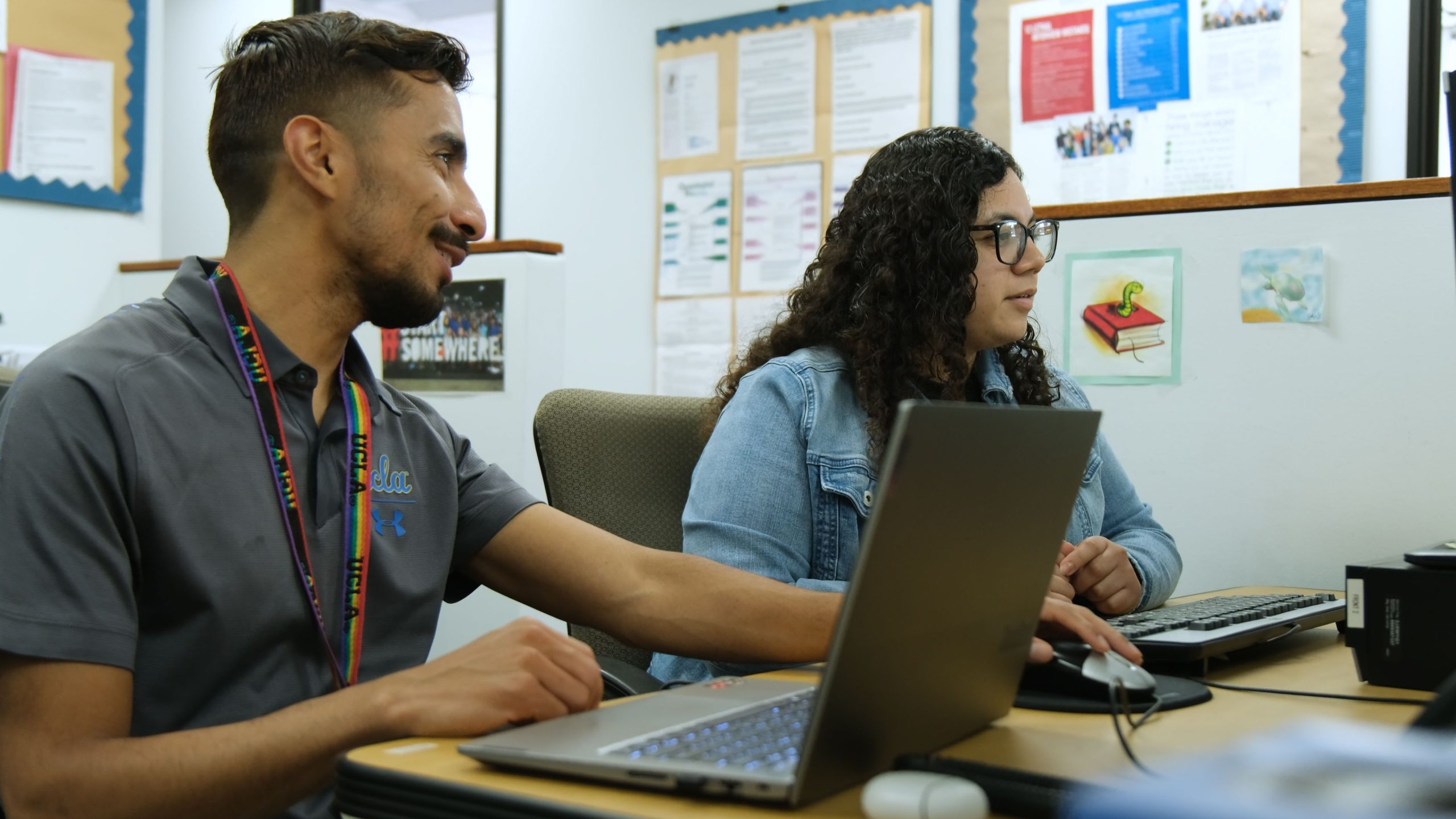 Two people working together in an office setting.