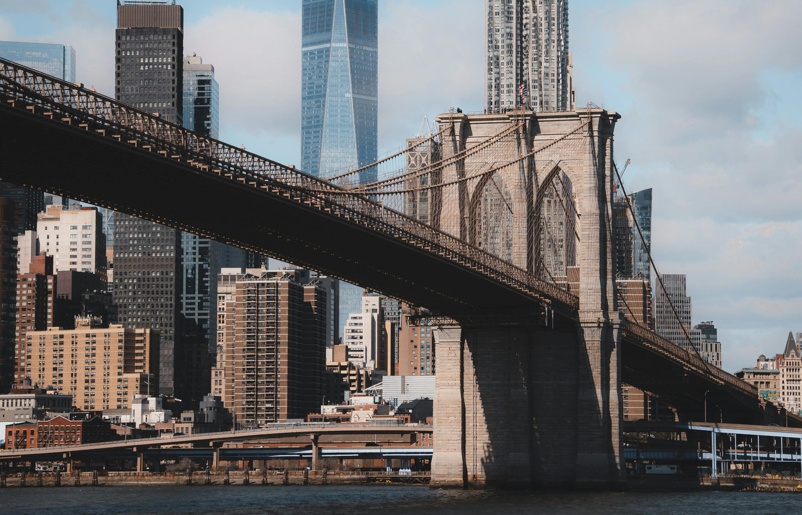 Brooklyn Bridge with NYC skyline in the background.