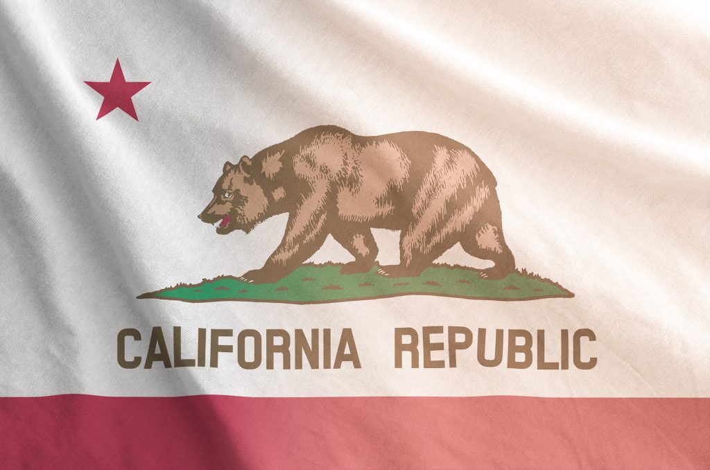California's state flag overlayed with an orange gradient