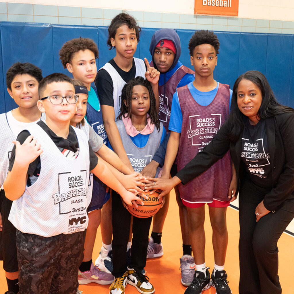 A group of children at a basketball court