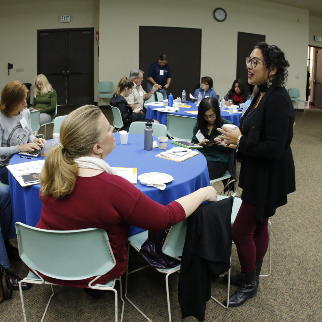 A group of people having a conversation at a table