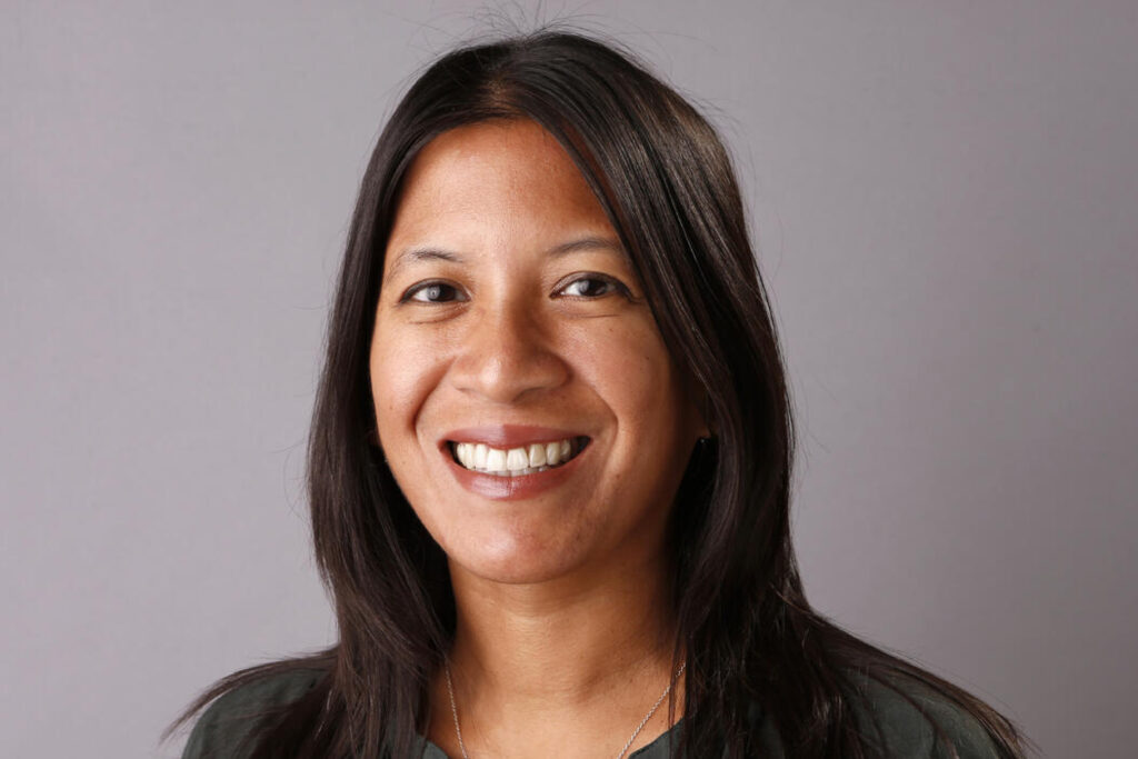 A smiling NFF employee