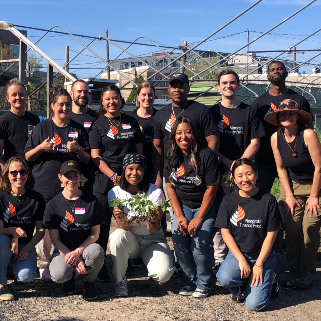 A group of volunteers wearing NFF tee shirts at a garden
